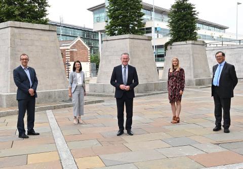 NI Fiscal Commissioners standing with the Finance Minister